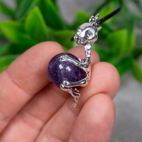 Skeleton Holding Purple Fluorite Sphere Necklace