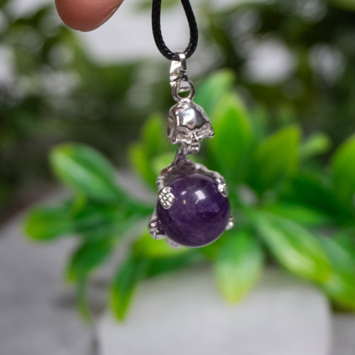 Skeleton Holding Purple Fluorite Sphere Necklace